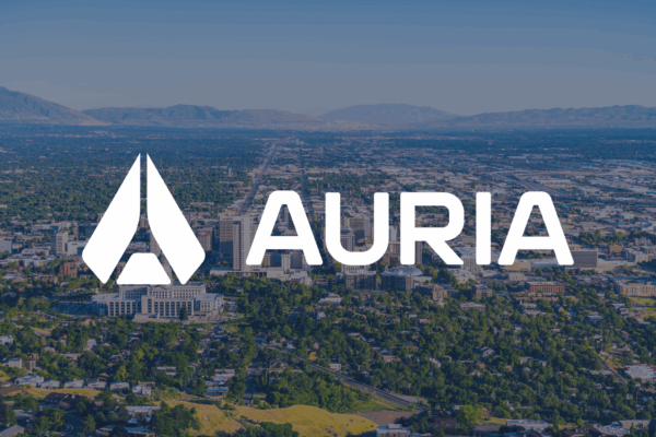 Auria logo overlaying a panoramic view of Salt Lake City, Utah, highlighting the company’s expansion into Weber County